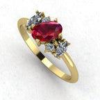 An angled perspective of the Atlantis ring, showcasing the organic design and the striking contrast of the red rubies and white diamonds against the gold band.