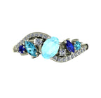 Top view of the Atlantis Storm ring highlighting the cluster of blue aquamarine and pavé set diamonds.