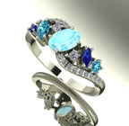 Angled view of the Atlantis Storm ring highlighting the cluster of blue aquamarine and pavé set diamonds.