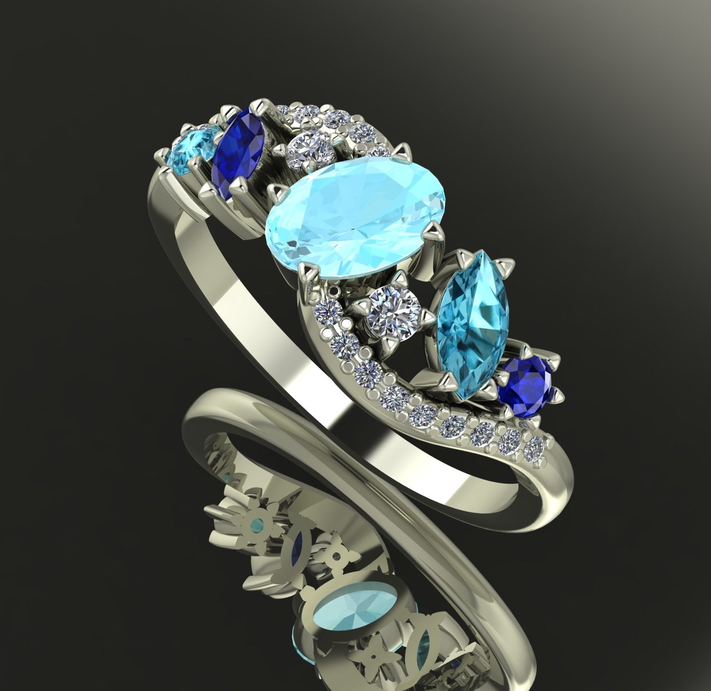 Angled view of the Atlantis Storm ring highlighting the cluster of blue aquamarine and pavé set diamonds. Shaded background.