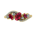 Top-down hero shot of the Atlantis Storm 18ct yellow gold ring featuring a clustered arrangement of vivid rubies and sparkling diamonds.
