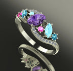 Angled shot of the handmade Atlantis Storm ring showcasing the sparkle and three-dimensional cluster of sapphires and zircons.