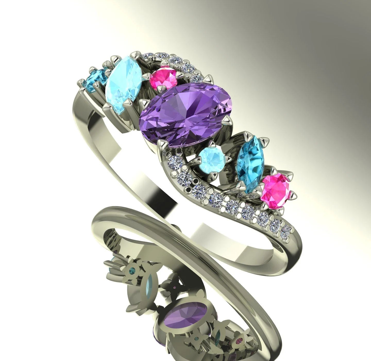 Angled shot of the handmade Atlantis Storm ring showcasing the sparkle and three-dimensional cluster of sapphires and zircons. Shaded background.