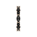 Detailed side view of the handcrafted 18ct rose gold finish against the deep black gemstones.