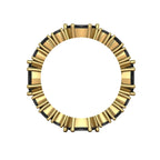 Close-up of the marquise black diamonds in the Allsorts yellow gold band through finger.
