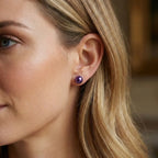 Model wearing black freshwater pearl stud earrings with sterling silver fittings by Nude Jewellery.