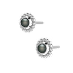An angled perspective of the Silver Mini Alto earrings, highlighting the three-dimensional architectural silver mounting and the dark, shimmering lustre of the black pearls.