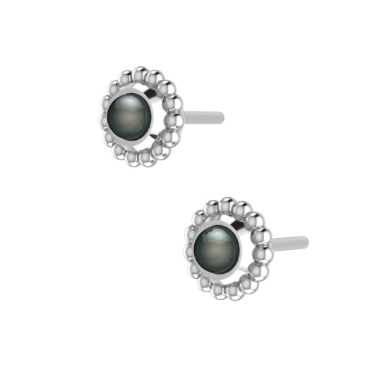 An angled perspective of the Silver Mini Alto earrings, highlighting the three-dimensional architectural silver mounting and the dark, shimmering lustre of the black pearls.