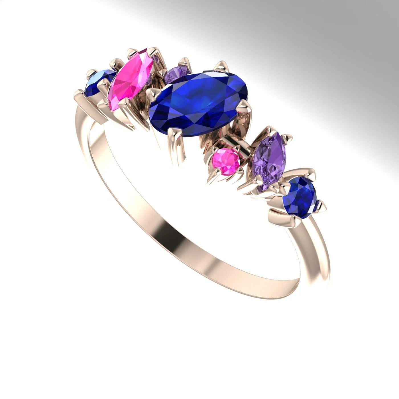 An angled view of the Atlantis Paradise ring highlighting the three-dimensional layout of the colourful sapphire cluster.