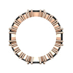 Close-up of the rose gold band showing the secure claw setting of the black diamonds.