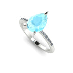 Angle view of the Calista engagement ring, featuring a massive 1.9-carat pear-shaped aquamarine framed by brilliant white diamonds.