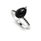Front three-quarter studio view of the Calista 2ct black diamond ring, highlighting the striking contrast of dark gemstones against a white precious metal band.