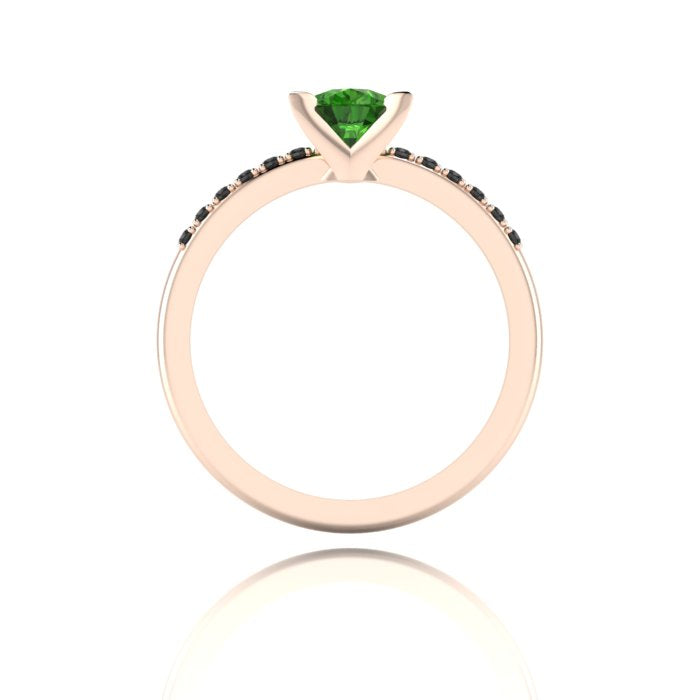 Through-finger view of the 18ct rose gold tourmaline ring, showing the clean interior under-gallery and precise black diamond settings.
