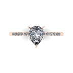Detail shot of the Calista alternative engagement ring, showing the exceptional clarity, cut, and light reflection within the central pear diamond.