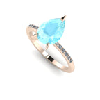 High angle studio detail shot of the Calista alternative engagement ring, showing the clear icy blue facets and exceptional light reflection within the aquamarine.