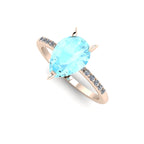 High angle studio detail shot of the Calista alternative engagement ring, showing the clear icy blue facets and exceptional light reflection within the aquamarine.