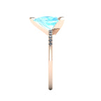 Side profile product photo of the Calista ring, displaying the clean, secure three-prong claw basket setting holding the 2-carat pear aquamarine.