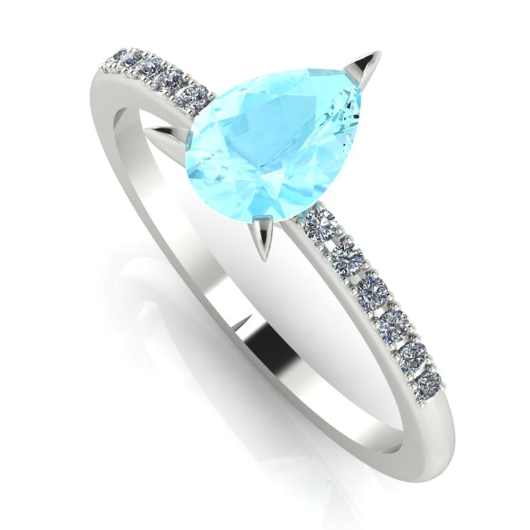 High angle studio detail shot of the Calista engagement ring, showing the crisp clarity and watery blue reflection through the facets of the aquamarine.