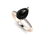 High angle studio detail shot of the Calista alternative engagement ring, showing the exceptional facet light reflections across the surface of the striking black diamond.