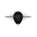 Calista engagement ring, featuring a bold 2-carat pear-shaped black diamond on a polished 18ct rose gold band with sparkling white diamond shoulders.