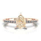 Calista pear shaped champagne diamond engagement ring in 18ct rose gold, top-down view showing the pear-shaped champagne diamond and white diamond shoulders, handmade in our London studio