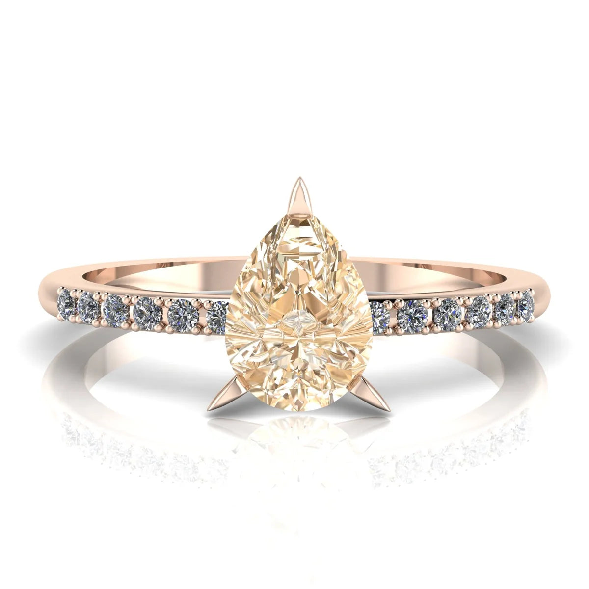 Calista pear shaped champagne diamond engagement ring in 18ct rose gold, top-down view showing the pear-shaped champagne diamond and white diamond shoulders, handmade in our London studio