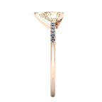 Calista pear shaped champagne diamond engagement ring in 18ct rose gold, side profile showing the elegant three-prong claw setting and pear-cut champagne diamond, handmade in our London studio