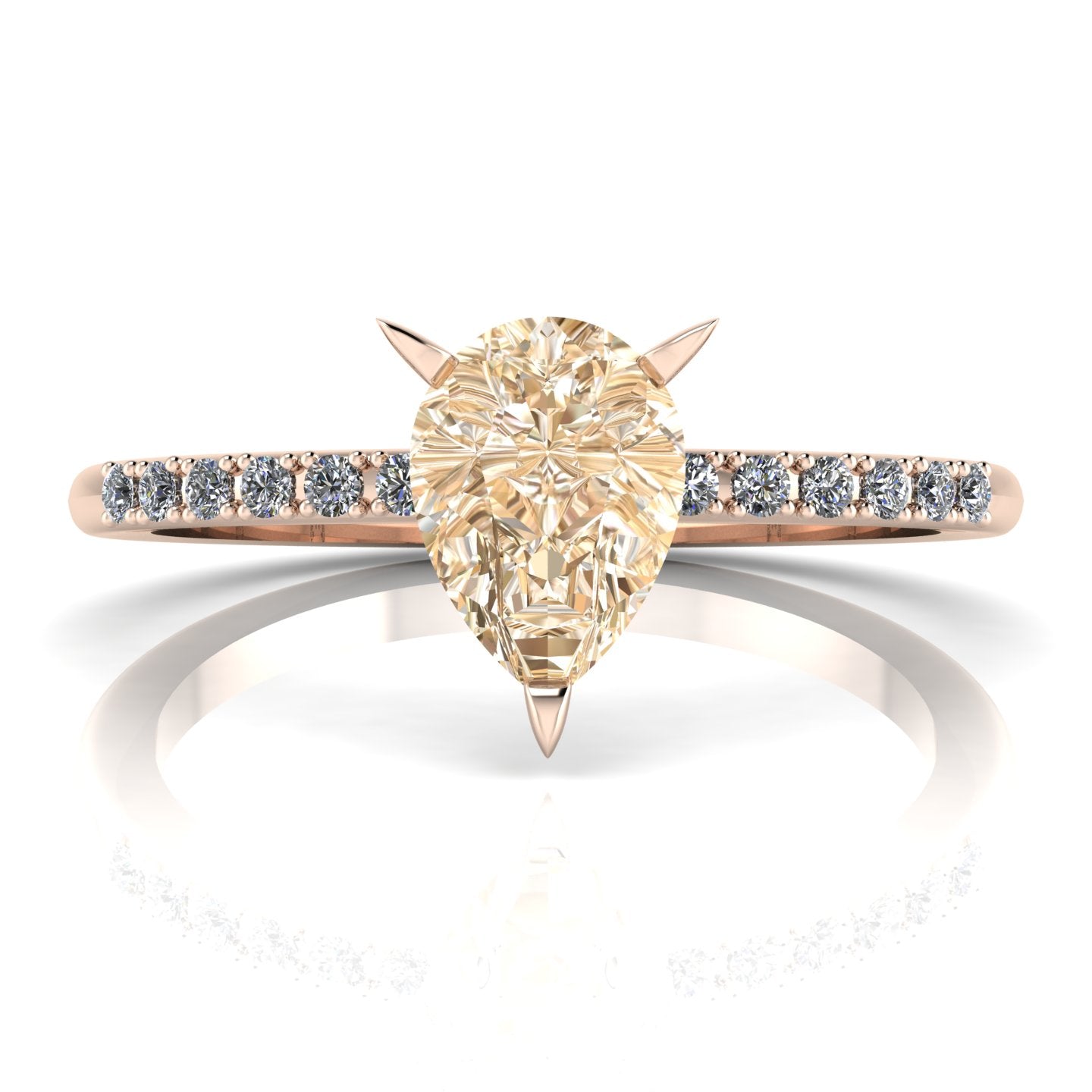 Front studio hero shot of the Calista ring, showcasing a prominent pear-shaped champagne diamond on a rose gold band with white diamond shoulders.