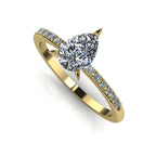 High angle studio detail shot of the Calista alternative engagement ring, showing the exceptional clarity and light reflection within the yellow gold diamond ring.