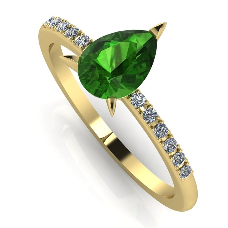 Front three-quarter studio view of the Calista tourmaline ring, showcasing the brilliant white pavé diamonds set into the warm yellow gold shoulders.