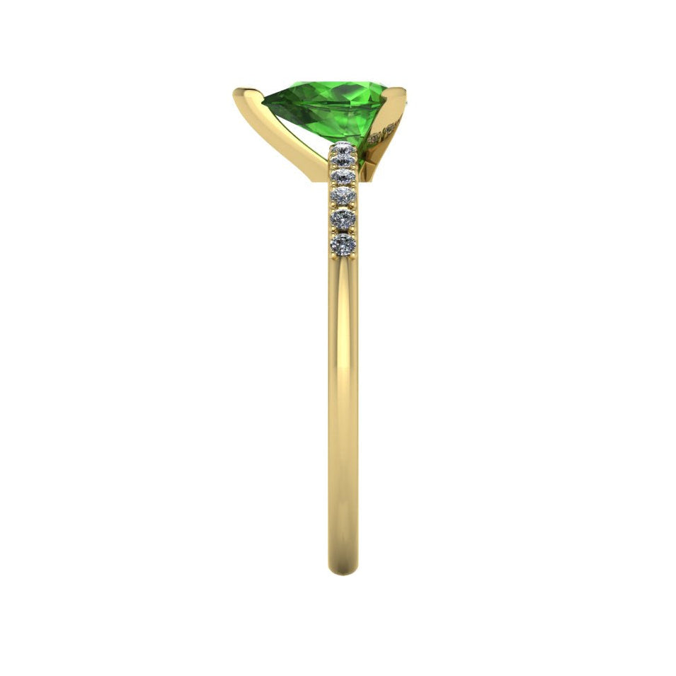 Side profile product photo of the Calista ring, displaying the clean, secure three-prong claw basket setting holding the pear green tourmaline.