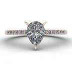 Calista engagement ring, featuring a brilliant pear-shaped lab-grown diamond on an 18ct rose gold band with diamond shoulders.