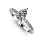 High angle studio detail shot of the Calista alternative engagement ring, highlighting the flawless clarity and light reflection across the central diamond facets.