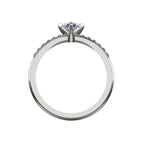 Through-finger view of the white gold or platinum diamond ring, showing the clean interior under-gallery and precise craftsmanship of the settings.