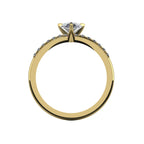 Through-finger view of the 18ct yellow gold lab diamond ring, showing the smooth interior under-gallery and precise stone settings.