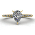 Calista engagement ring, featuring a brilliant pear-shaped lab-grown diamond on an 18ct yellow gold band with diamond shoulders.