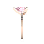 Side profile product photo of the Calista ring, displaying the elegant three-prong claw basket setting holding the 2-carat pear morganite.