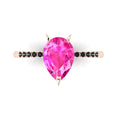 Calista engagement ring, featuring a vibrant 2-carat pear-shaped pink sapphire on an 18ct rose gold band with dramatic black diamond shoulders.
