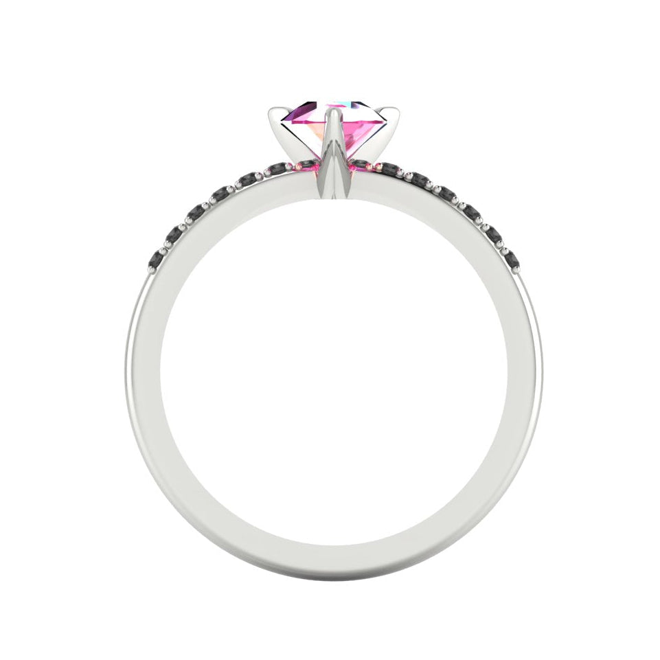 Through-finger view of the white gold or platinum sapphire ring, showing the clean interior under-gallery and precise settings for the accent black diamonds.