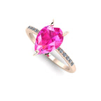 High angle studio detail shot of the Calista alternative engagement ring, showing the exceptional clarity and rich pink light reflections within the sapphire.