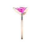 Side profile product photo of the Calista ring, displaying the clean, secure three-prong claw basket setting holding the 2-carat pear pink sapphire.