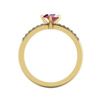 Through-finger view of the 18ct yellow gold ruby ring, displaying the smooth, polished interior under-gallery and precise stone settings.