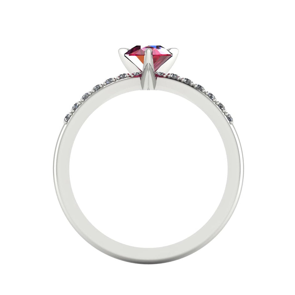 Through-finger view of the white gold or platinum ruby ring, showing the clean interior under-gallery and precise craftsmanship of the diamond settings.