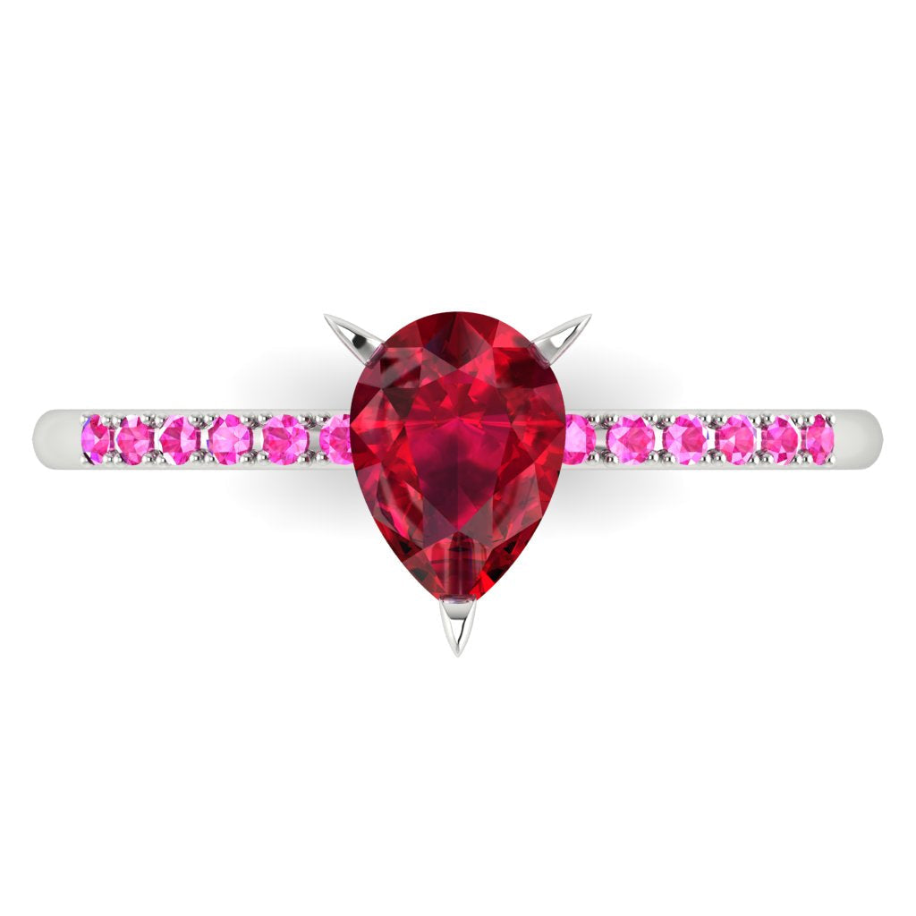 detail shot of the Calista alternative engagement ring, showing the deep red clarity of the ruby alongside the bright pink hue of the shoulder stones.