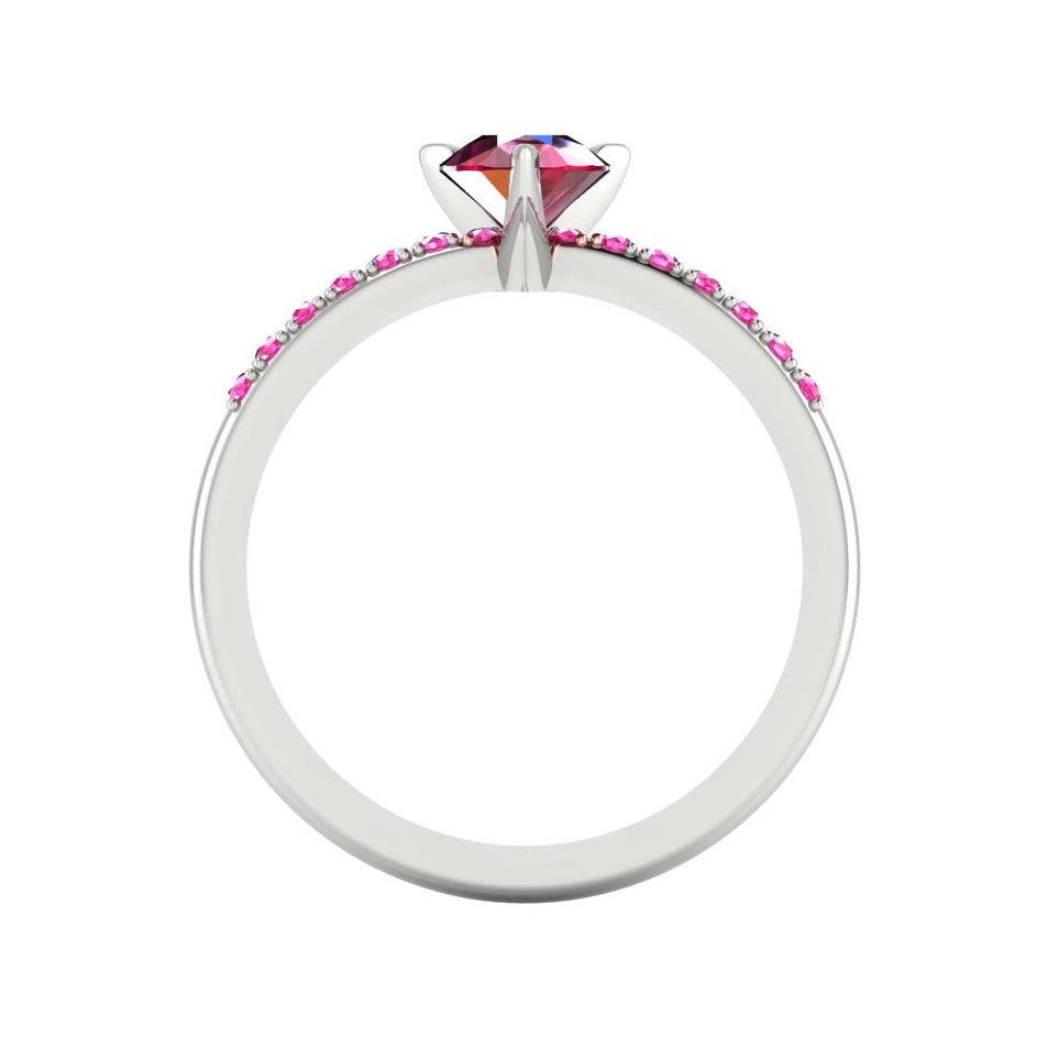 Through-finger view of the white gold or platinum ring, showing the clean interior under-gallery and precise craftsmanship of the pink sapphire settings.