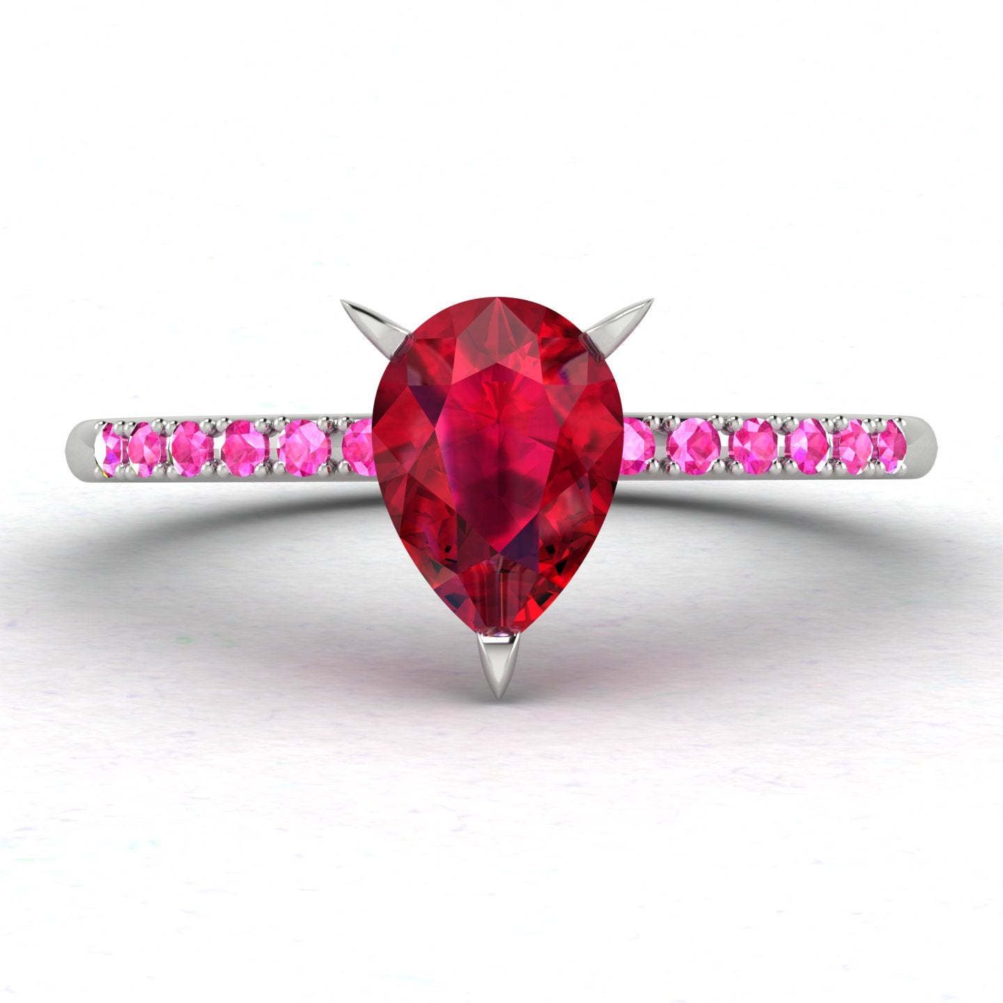 Calista engagement ring, showcasing a prominent pear-shaped red ruby on a white gold or platinum band with vibrant pink sapphire shoulders.