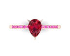 High angle studio detail shot of the Calista alternative bridal ring, showing the rich red clarity of the ruby alongside the bright pink hue of the shoulder stones.