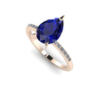 Calista sapphire ring in 18ct rose gold, capturing the deep, velvety blue shimmer of the 2-carat pear centre stone and its brilliant white diamond shoulders.