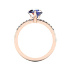 Through-finger view of the 18ct rose gold sapphire ring, showing the smooth, polished interior under-gallery and precise stone settings.