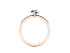 Through-finger view of the 18ct rose gold sapphire ring, displaying the clean interior under-gallery and precise craftsmanship of the diamond settings.